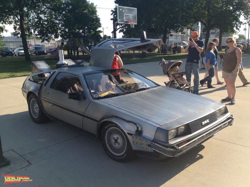 The crowds start to swell as they gather around the rented Back to the Future and enjoy the magical interior and exterior features.